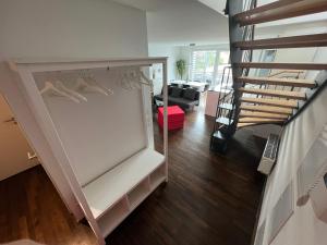 a room with a white closet with shoes in it at Penthouse-Wohnung - Balkon - Dachterrasse - Zentrum in Nuremberg