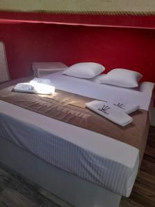 Ein Bett oder Betten in einem Zimmer der Unterkunft NEPTUNUS