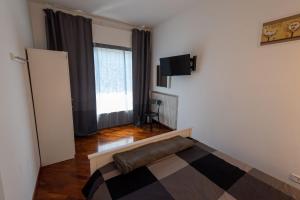 TV a/nebo společenská místnost v ubytování SUITE184
