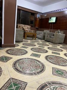 a lobby with a floor with mosaics on it at Dareen Hotel in Marsa Matruh
