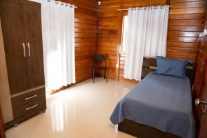 En eller flere senger på et rom på Casa de Campo com Churrasq em Marechal Floriano - ES