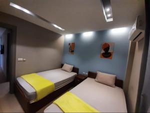 Ένα ή περισσότερα κρεβάτια σε δωμάτιο στο Madinaty 3