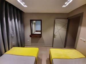 Ένα ή περισσότερα κρεβάτια σε δωμάτιο στο Madinaty 3 +3 φωτογραφίες