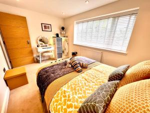 a bedroom with two beds and a window at The Duplex Margate with Deck, Mini Bar & Air Conditioning in Margate