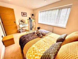 a bedroom with two beds and a window at The Duplex with Air Conditioning & Private Deck Area in Margate