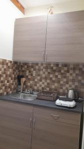Kuchyňa alebo kuchynka v ubytovaní Magnolia apartman
