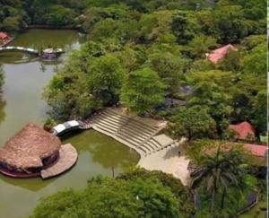 an aerial view of a park with trees and a river at casa blanca in Restrepo