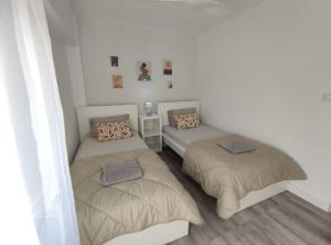 Säng eller sängar i ett rum på Sande Playa De Gandia