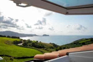 a view of the ocean from a house at Hotel Boutique Berazadi Berri in Zarautz