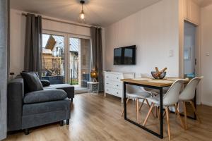 Telewizja i/lub zestaw kina domowego w obiekcie Apartamenty Kuracyjna