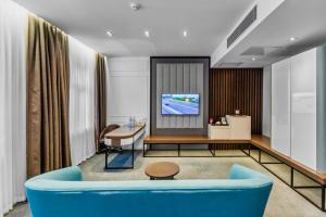 TV a/nebo společenská místnost v ubytování Ivy Garden Hotel Baku