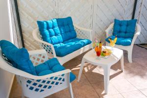 a room with two chairs and a table at Fitosinn Hotel in Paphos