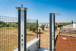 a view from a balcony with a fence at PS Apartments in Pula