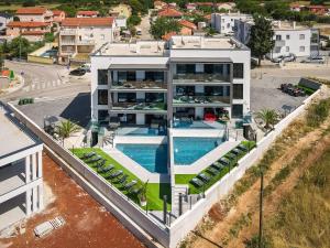 an aerial view of a house with a swimming pool at PS Apartments in Pula +64 photos