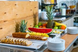 a buffet with different types of food on a table at Fitosinn Hotel in Paphos