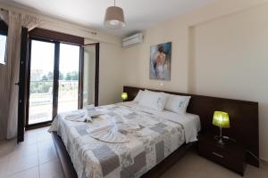 Letto o letti in una camera di Ariadni -Villas- luxury houses