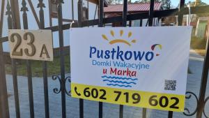 Certyfikat, podpis lub inny dokument wystawiony w obiekcie Pustkowo Domki Wakacyjne u Marka