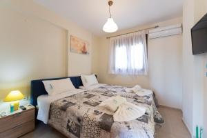 Letto o letti in una camera di Ariadni -Villas- luxury houses