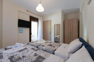 Letto o letti in una camera di Ariadni -Villas- luxury houses