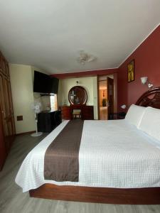 Voodi või voodid majutusasutuse Hotel Cumbayá Sanvy toas