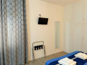 Postel nebo postele na pokoji v ubytování Residenza Borgo Trento SUNDAY