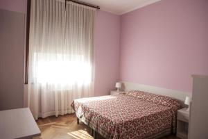 Postel nebo postele na pokoji v ubytování Italy Inn + 4 fotografie