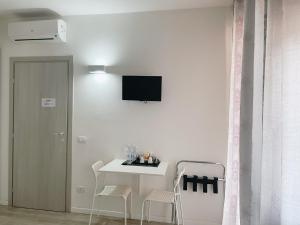 TV a/nebo společenská místnost v ubytování Residenza Borgo Trento SUNDAY