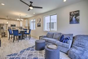 a living room with a couch and a table at Executive Chandler Townhome with Community Perks in Chandler