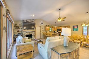 a living room with a couch and a table at Boat Dock! Lakefront Group Getaway in Eldon in Eldon