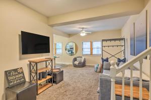a large living room with a flat screen tv at Renovated Lake Geneva Home Near Dtwn and Beach! in Lake Geneva