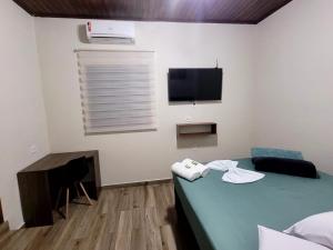 Postel nebo postele na pokoji v ubytování Hotel Serra do Mar