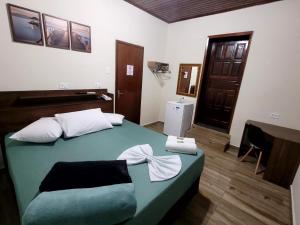 Postel nebo postele na pokoji v ubytování Hotel Serra do Mar