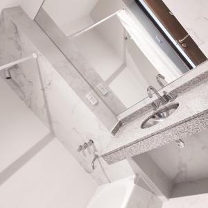 a bathroom with a sink and a mirror at PR Apart - Alquileres Temporarios in San Miguel de Tucumán +59 photos
