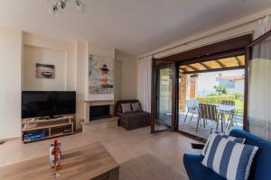 TV o dispositivi per l'intrattenimento presso Ariadni -Villas- luxury houses