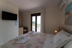 Letto o letti in una camera di Ariadni -Villas- luxury houses