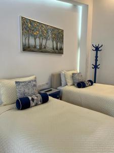 Postel nebo postele na pokoji v ubytování Adamas House Hotel Boutique
