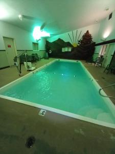a large swimming pool in a room with at Lupine Inn in Red Lodge