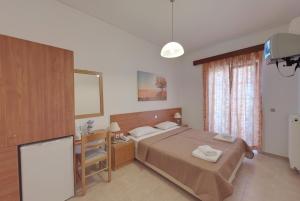 Posteľ alebo postele v izbe v ubytovaní Marirena Hotel