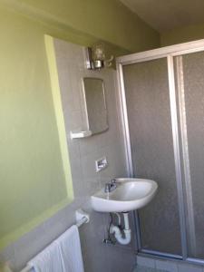 Koupelna v ubytování Hotel Lorena