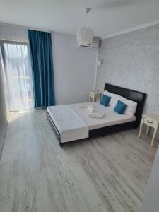 Ένα ή περισσότερα κρεβάτια σε δωμάτιο στο Vila OK