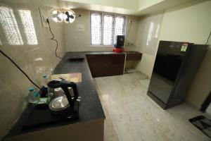 Dapur atau dapur kecil di Royal Home Stay deluxe Room