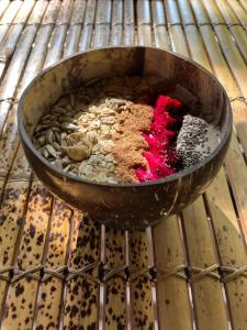 a bowl filled with food on top of an oven at Meno Madia Bungalows in Gili Meno