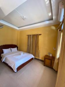 Llit o llits en una habitació de ISLANDS BOUTIQUE Koh Rong