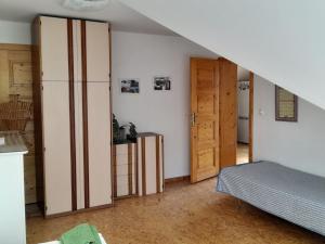 Postel nebo postele na pokoji v ubytování APARTMÁN ČESKÁ KANADA