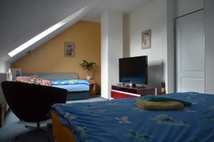 Ein Bett oder Betten in einem Zimmer der Unterkunft Penzion Aura