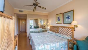 Llit o llits en una habitació de Blue Sea Costa Bastian