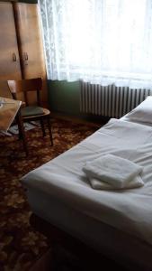 Säng eller sängar i ett rum på Hikers Paradise Private Apartment in Poprad