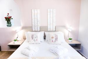 Säng eller sängar i ett rum på Sonio Villas - Que Bella Collection