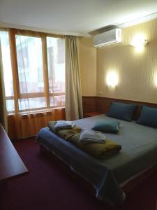 Ένα ή περισσότερα κρεβάτια σε δωμάτιο στο Санта Марина