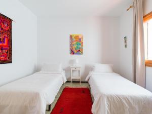 A bed or beds in a room at Agaete Pupe Home by Canariasgetaway